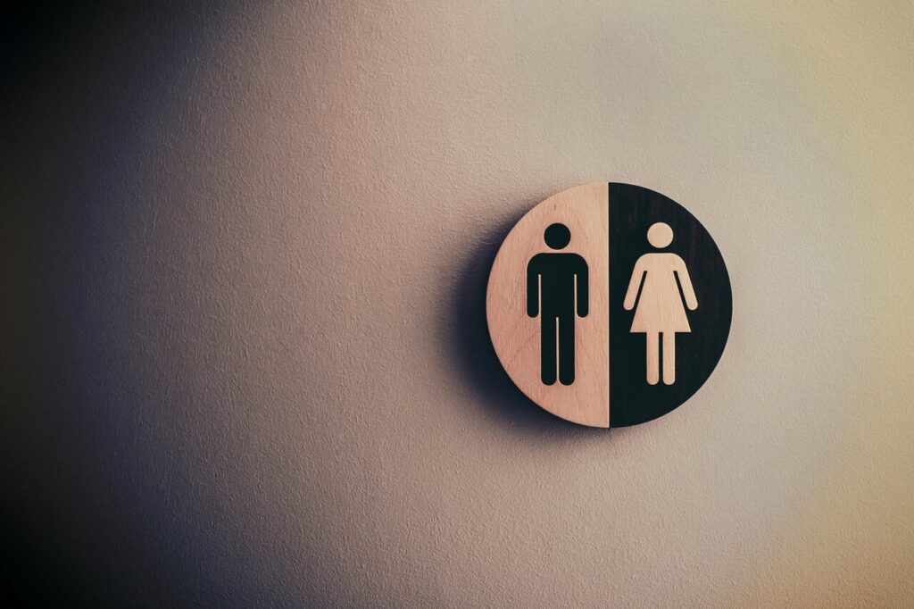 Symbol toalety damskiej i męskiej na ścianie